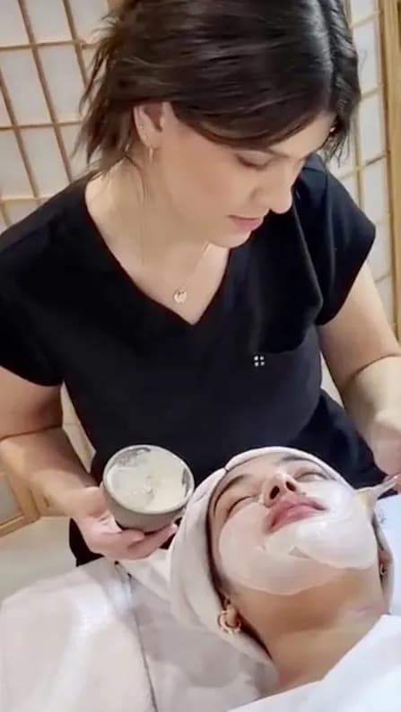 Esthetician performing chemical peel treatment