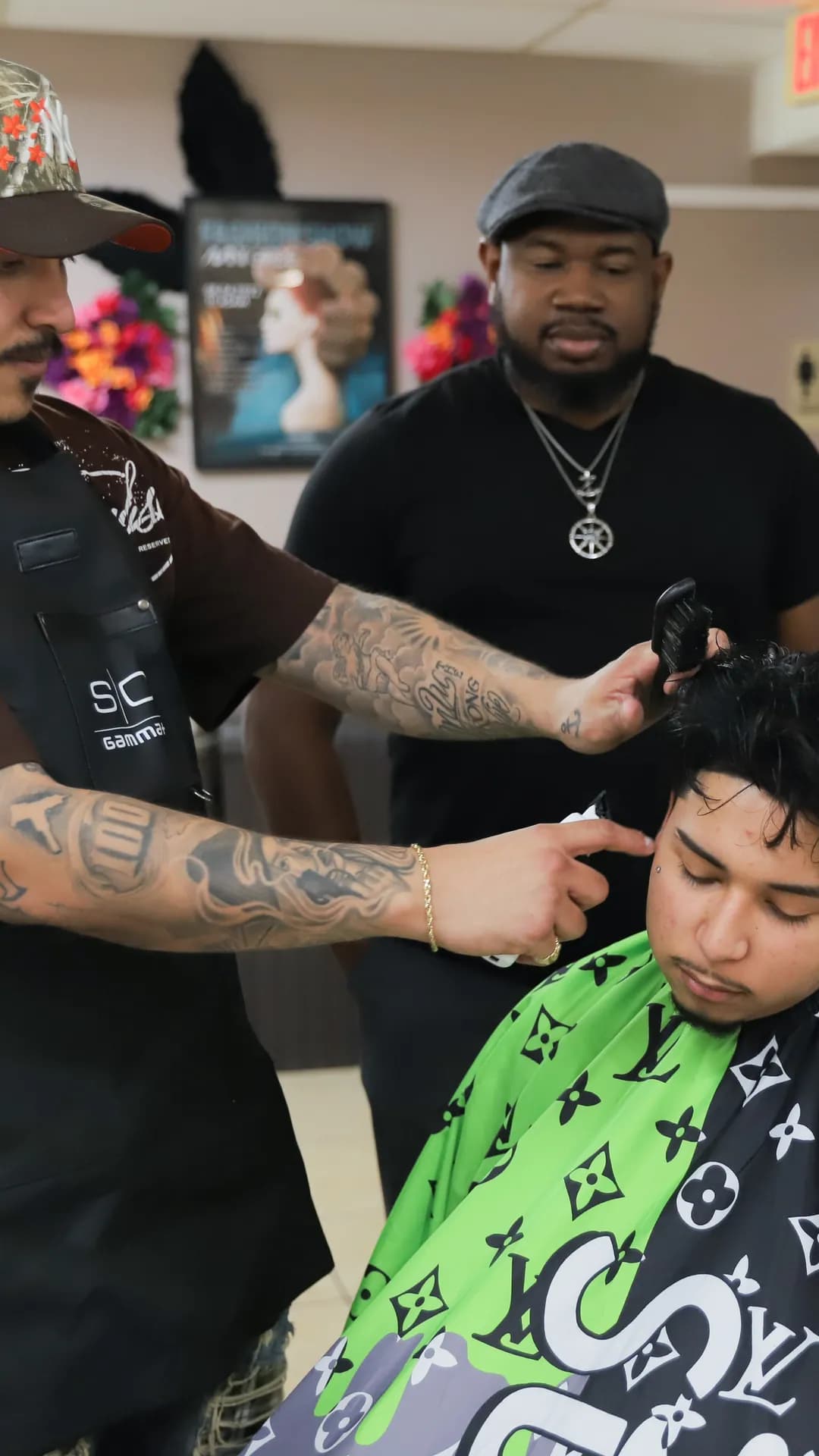 Cosmetologist learning clipper techniques