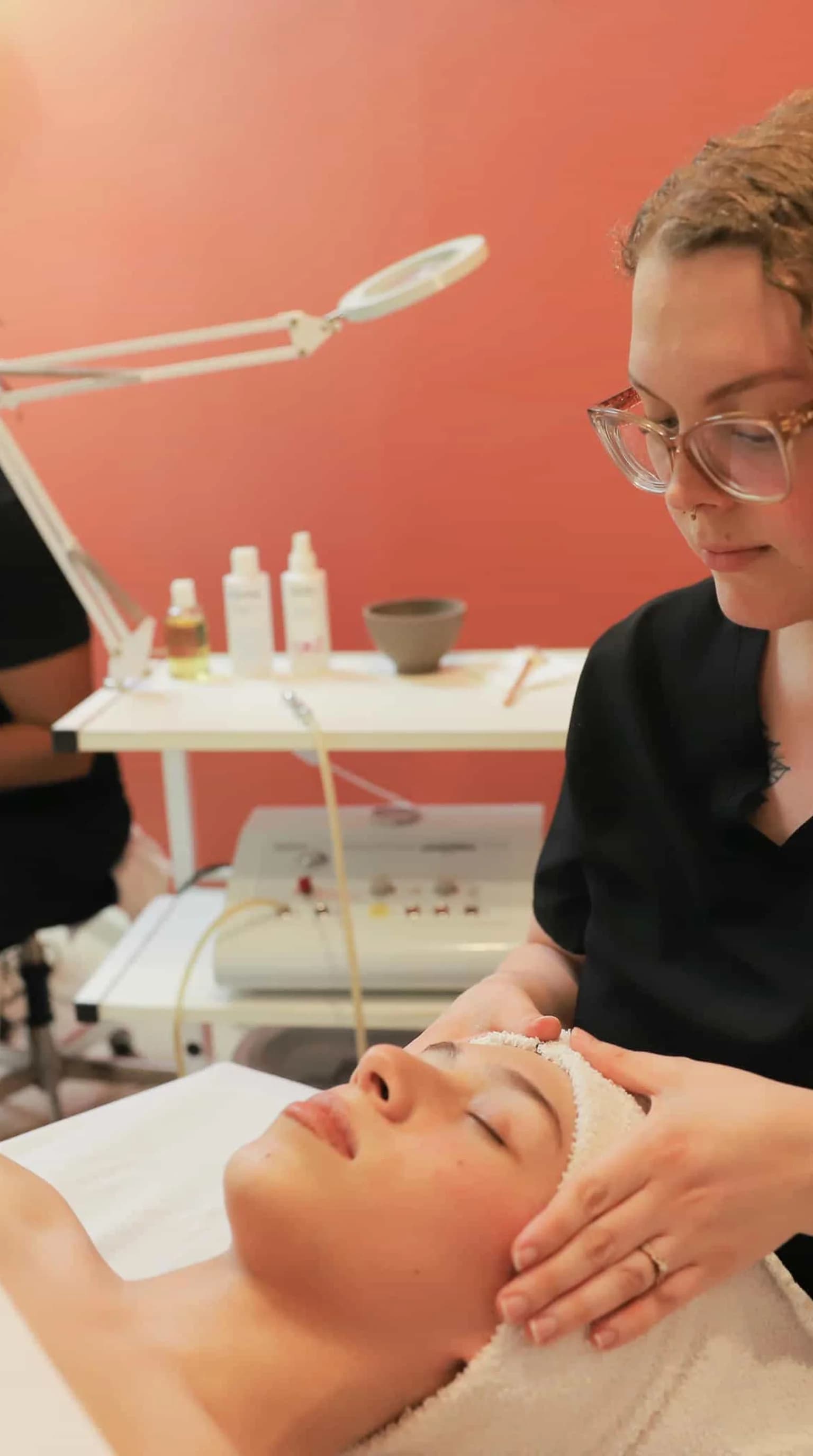 Young esthetician student in modern treatment room