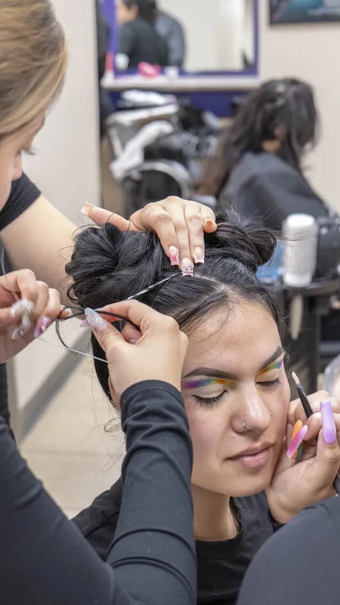Makeup artist creating dramatic look