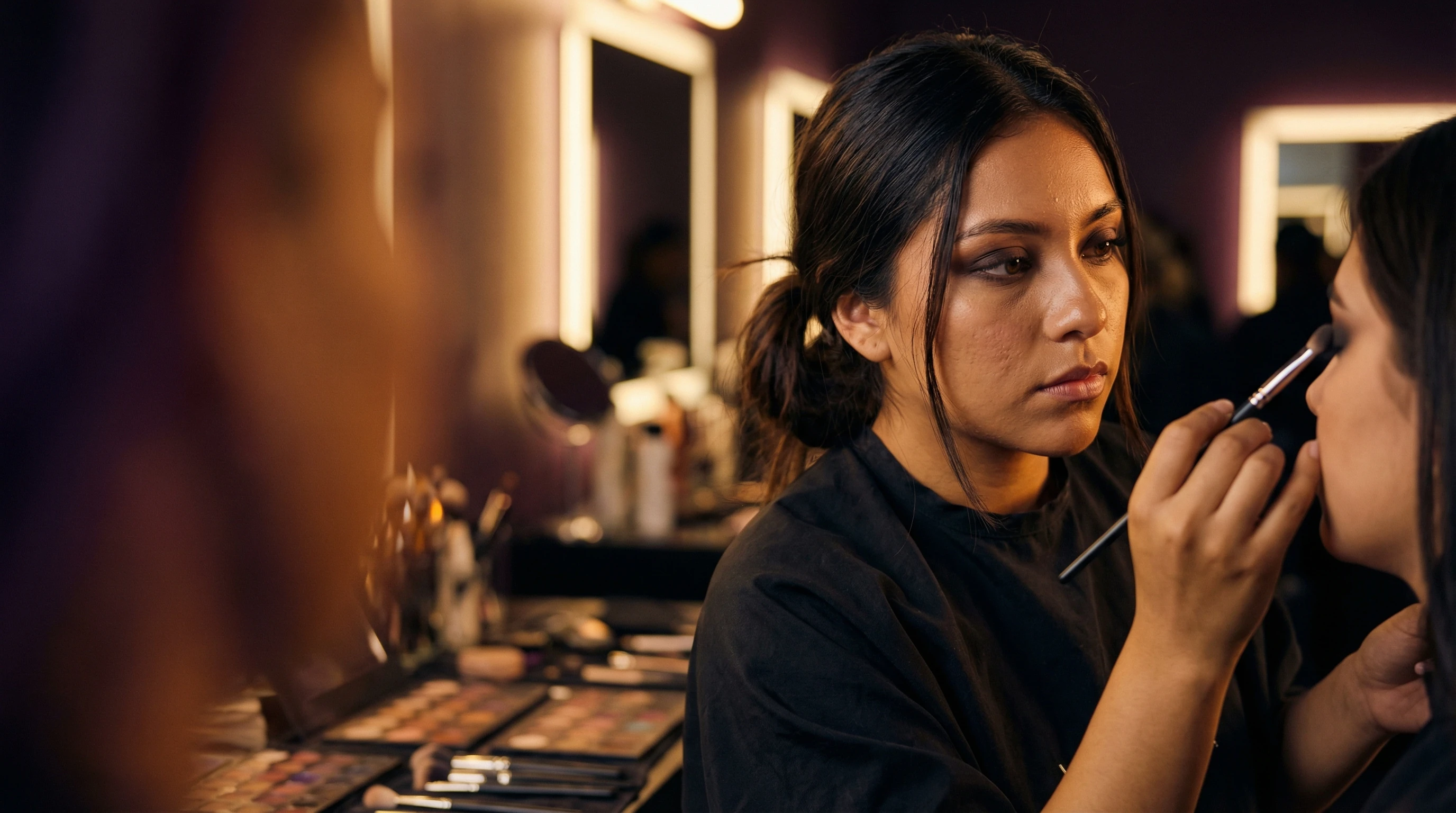 Makeup artist creating dramatic look
